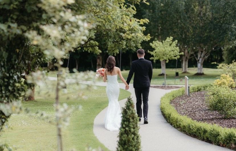 wedding couple walking from behind