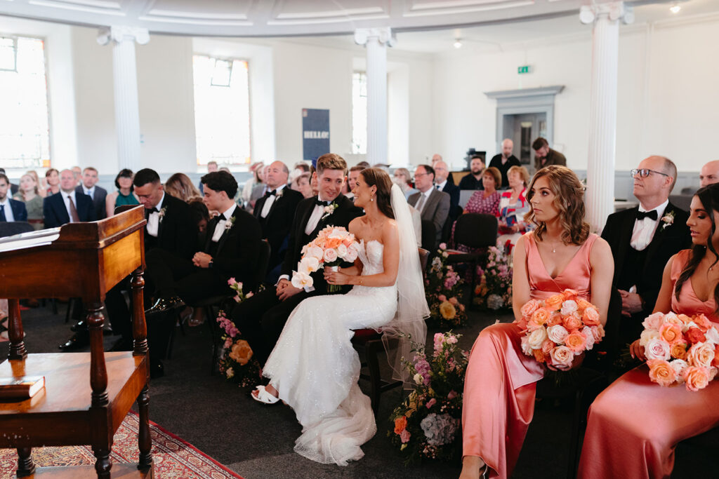 bride and groom sitting during wedding ceremony