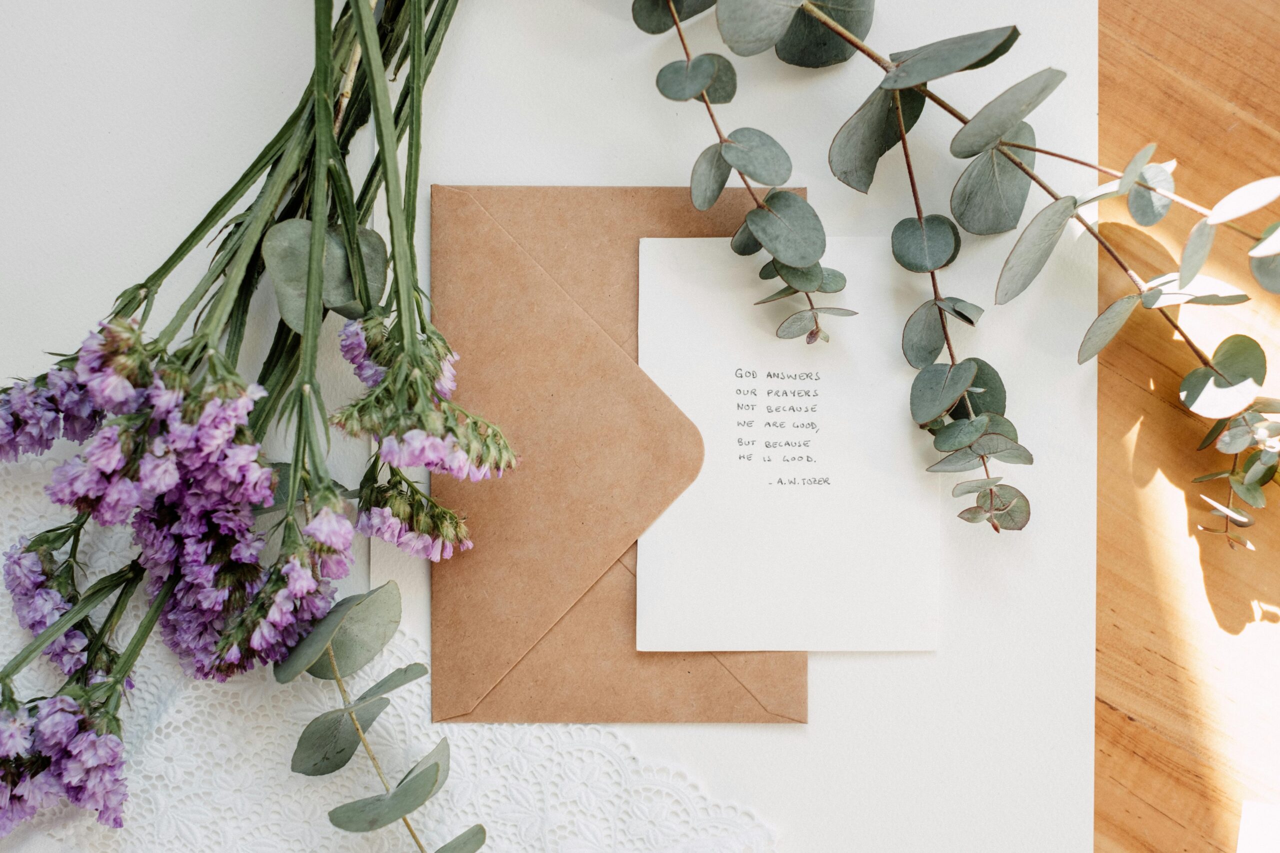 Wedding invitation on table with flowers