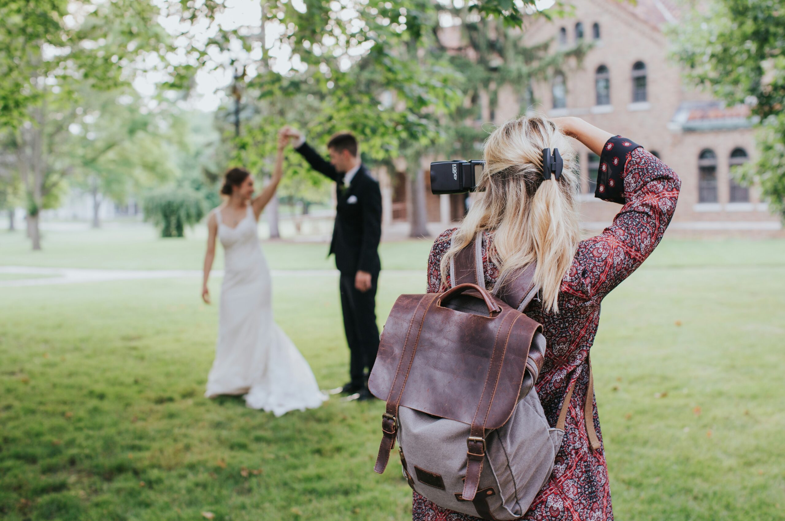 wedding photographer taking picture of couple